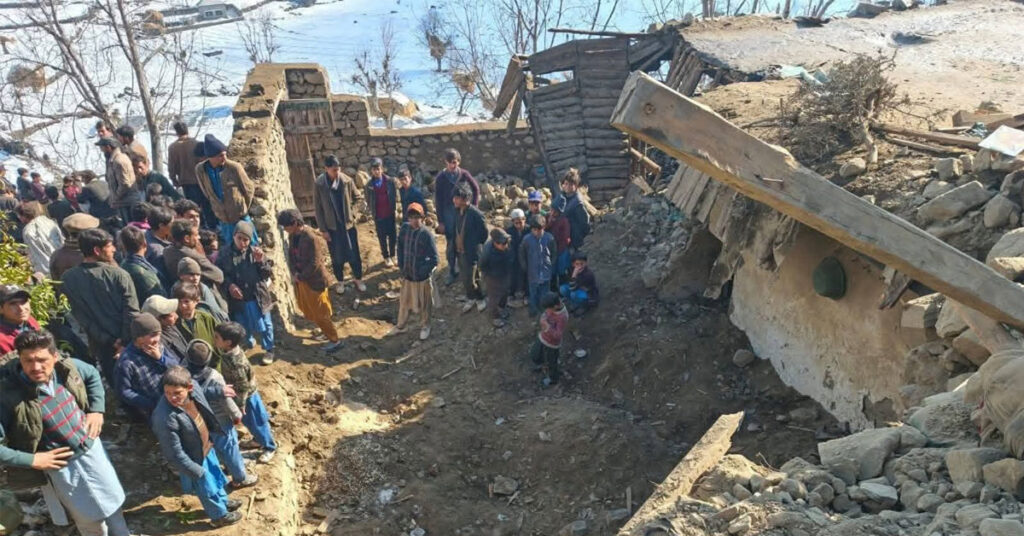 Collapsed three-story residential building in Diamer due to heavy snowfall, with rescue teams and locals assisting victims.