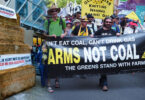 Pakistani and Filipino farmers protesting against fossil fuel polluters, demanding climate justice and compensation for crop losses caused by floods and storms