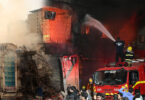 Smoke and debris after Gul Plaza fire highlighting environmental pollution in Karachi